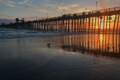 Sunset from the sand by Oceanside pier