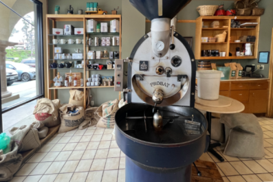 Coffee bean grinder at La Costa Coffee Roasting in Carlsbad, California