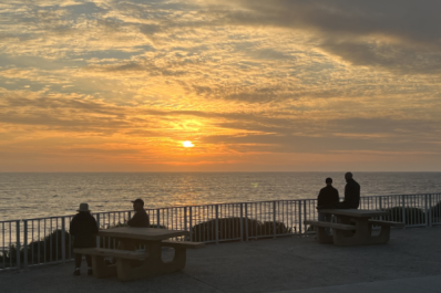 Sunset from picnic tables above Tamarack beach in Carlsbad, California
